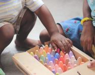 Child picking crayons Tina Floersch unsplash