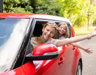 family having fun in car