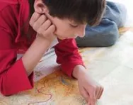 Boy studying a map