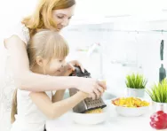 Child learning to cook