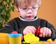 Child playing with playdough