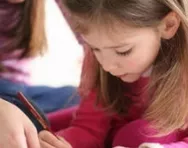 Little girl writing