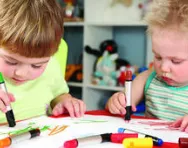 Children colouring in together