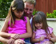 Dad reading to sisters