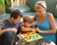 Family playing a board game