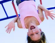 Girl on climbing frame