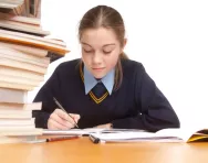 Girl writing at desk