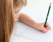 Girl writing in exercise book