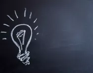 Light bulb on blackboard