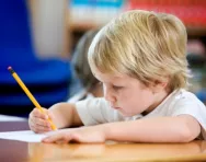 Little boy writing