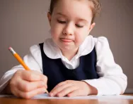 Little girl concentrating on her work