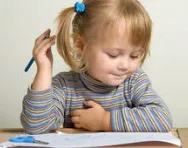 Little girl writing