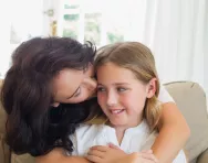 Mother and daughter hug