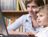 Mum and child working at computer together