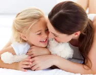 Mum and daughter giggling