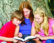 Mum reading to son and daughter