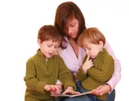 Mum reading with her sons