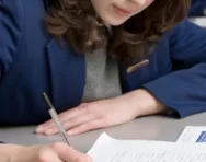 Secondary school girl writing