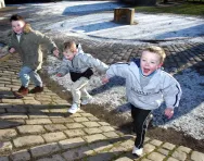 Children playing outdoors in the snow