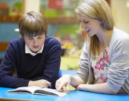 Teacher and pupil reading