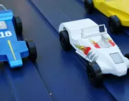 Toy cars going down a slope