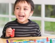 Boy playing board game