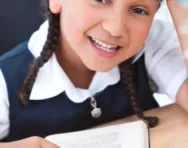 Girl reading at her desk