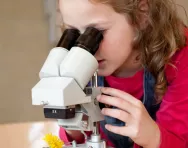 Girl with microscope