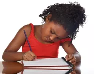 Girl writing in notebook