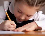 Little girl writing