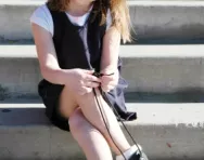 Little girl tying shoe laces