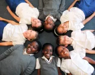 Year 4 children lying in a circle