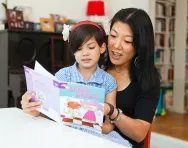 Mum and daughter reading together