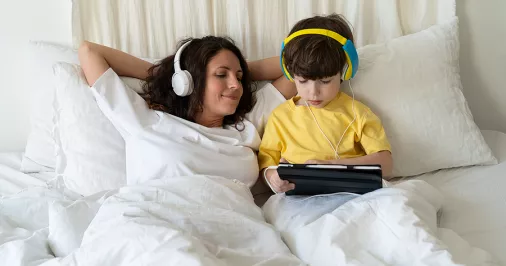 Bigstock mother and son listening in bed