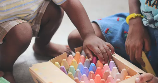 Child picking crayons Tina Floersch unsplash